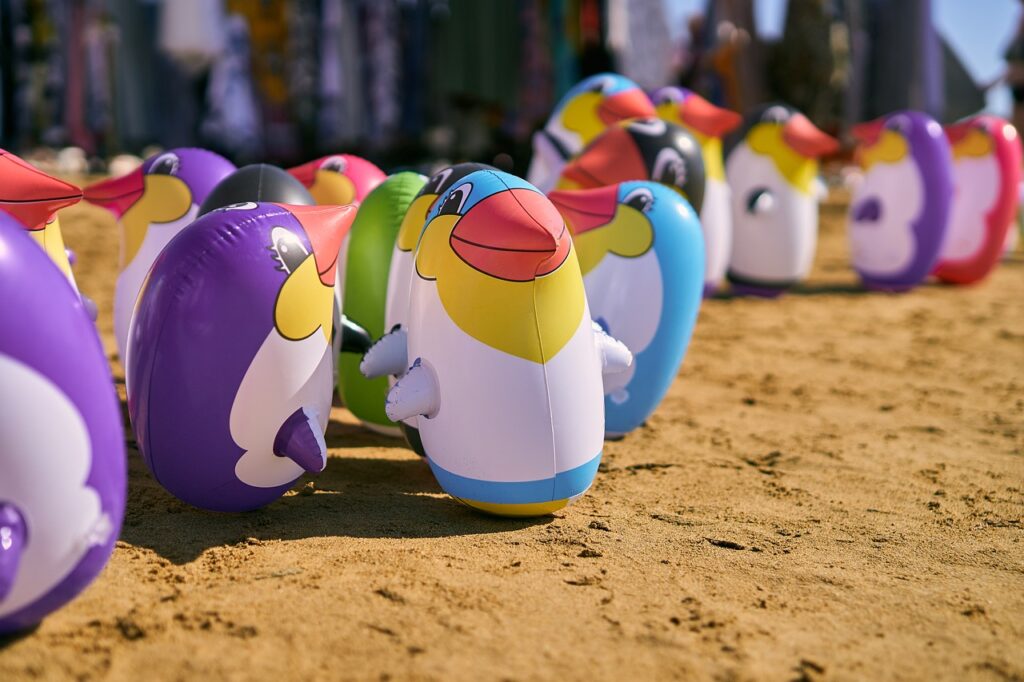 Should I bring my own beach toys and games, or are they usually available at the destination?